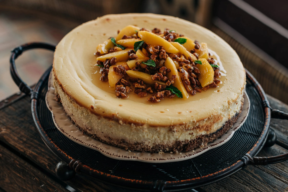 Cheesecake with fruit topping on a wooden surface