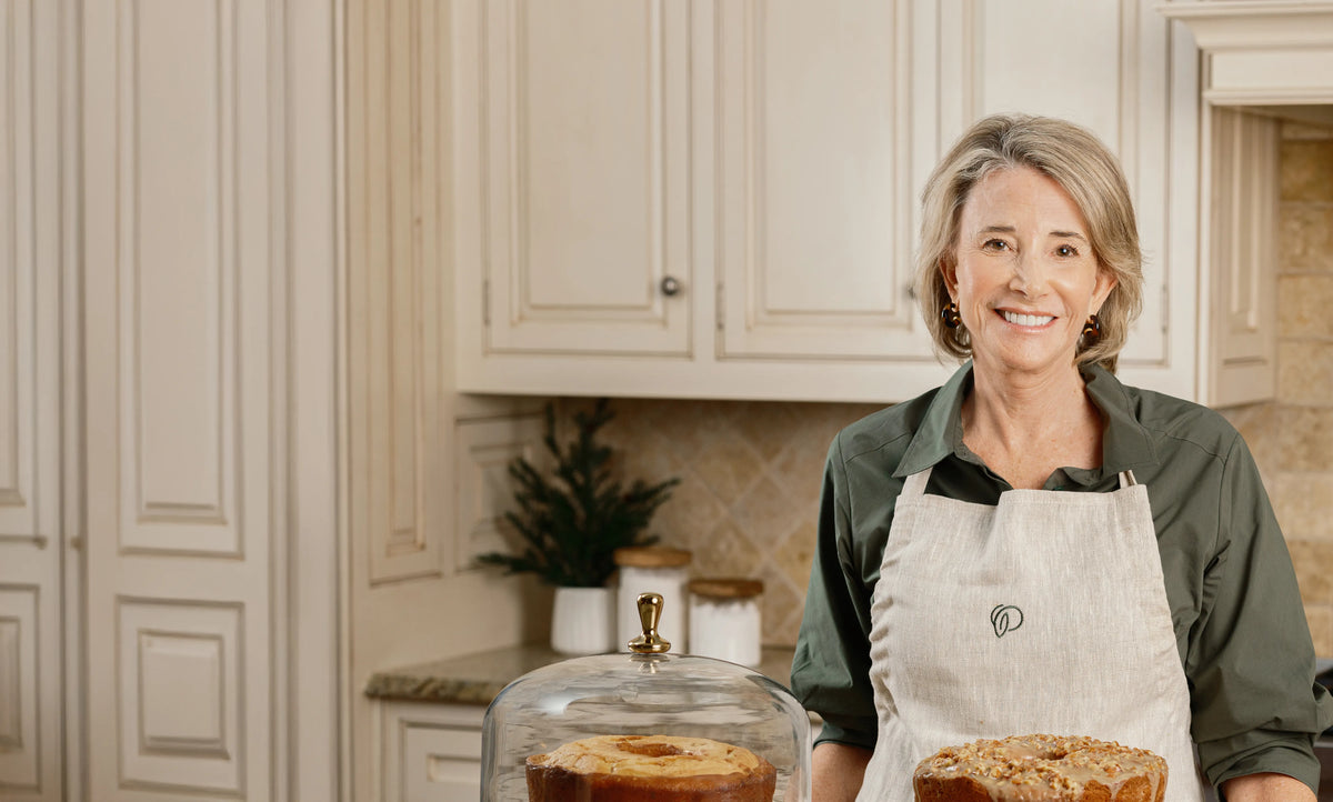 Ms. Mary in Kitchen wearing an apron 